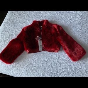 bebe faux fur cropped jacket in deep red.